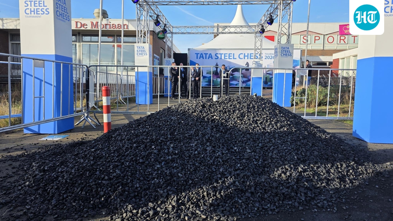 Climate activists dump coal, chain themselves to gates as protest delays Tata Steel Chess start