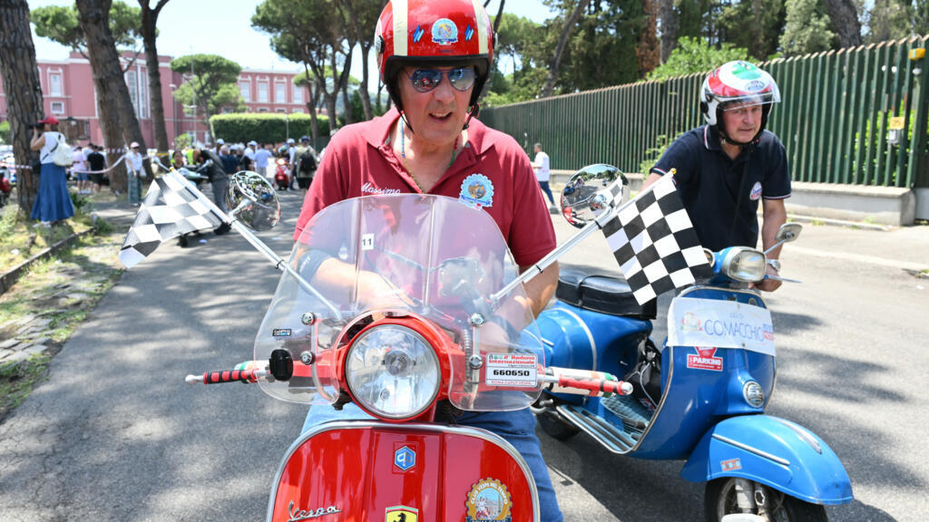 ‘Vespa is a way of life’: Thousands ride through Rome as Italy’s iconic scooter turns 80
