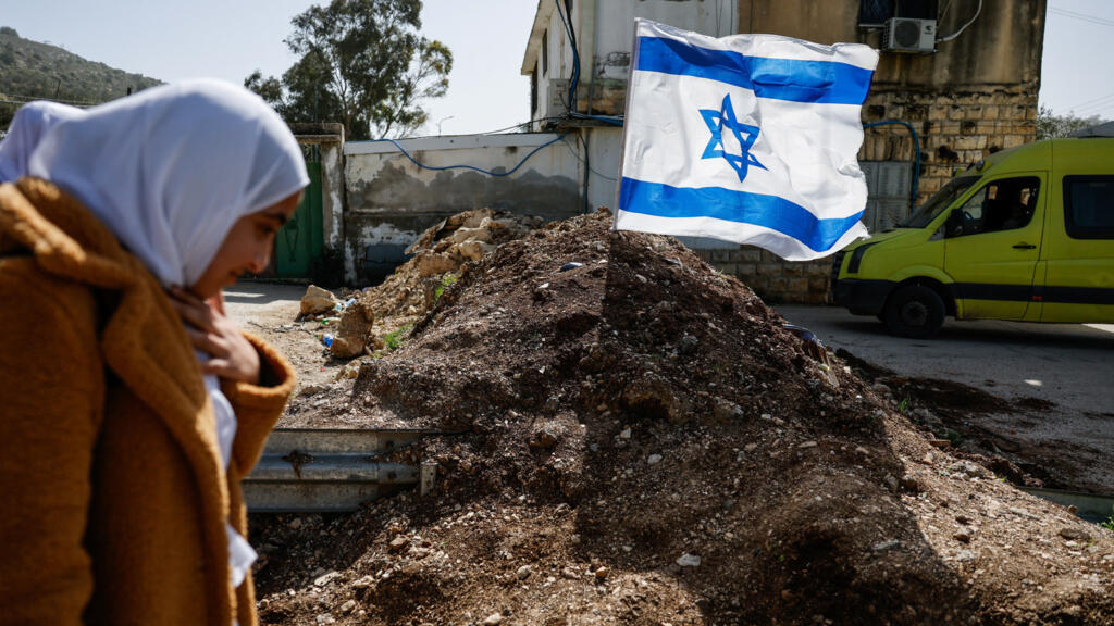 West Bank settler violence surges as Israeli strikes in Gaza kill 4 Palestinians