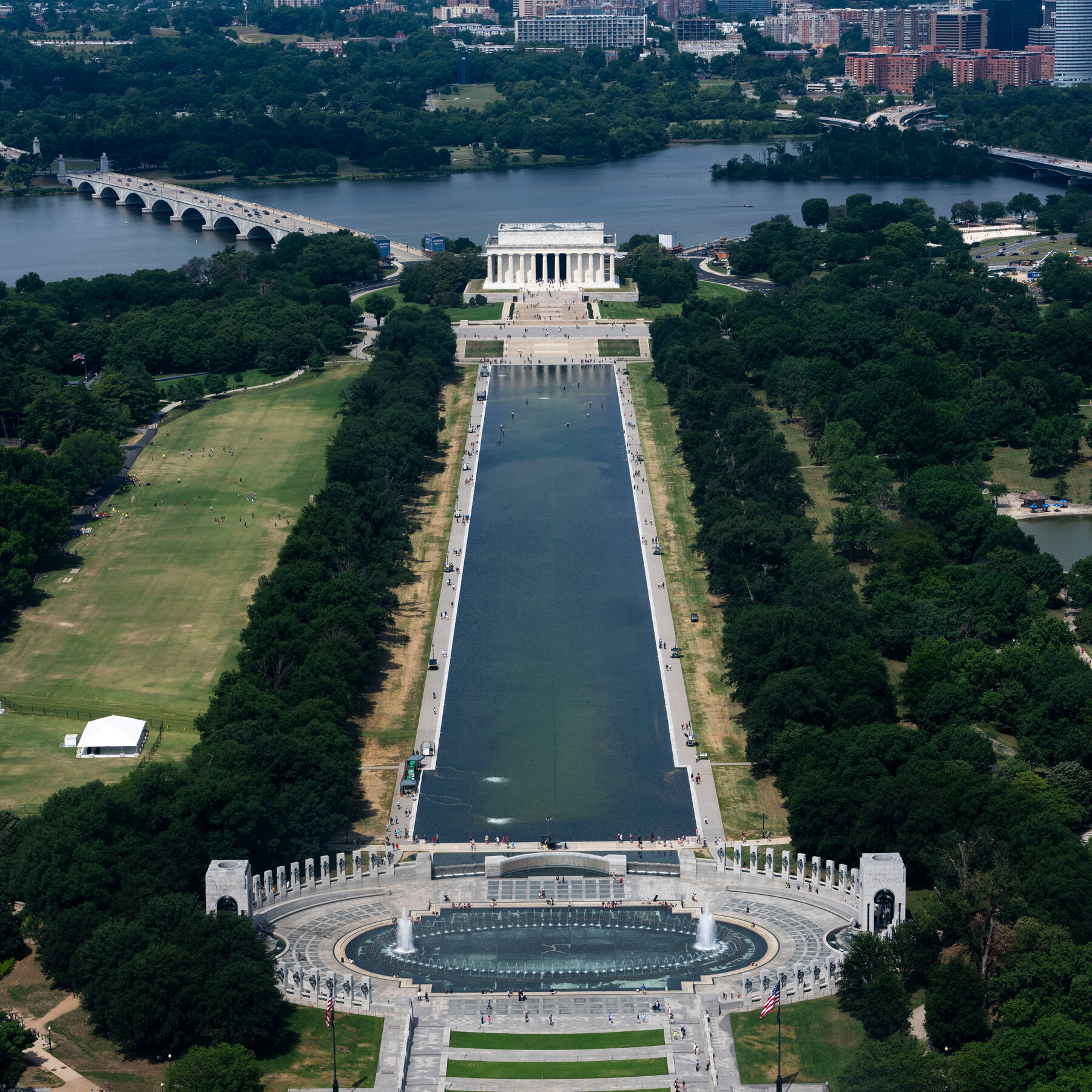 Visitors Look at the Reflecting Pool and Disagree on What They See