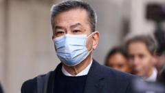 Hong Kong government employee denies ordering surveillance of UK dissidents