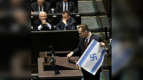 MP brandishes Israeli flag with swastika in Polish parliament (VIDEO)