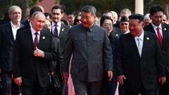 Moment Xi, Putin and Kim pose with world leaders at China's military parade