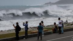 East Asia braces for destructive typhoon as landslides kill 15 in Philippines