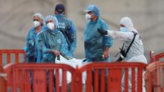 Last passengers leave virus-hit cruise ship as three more test positive