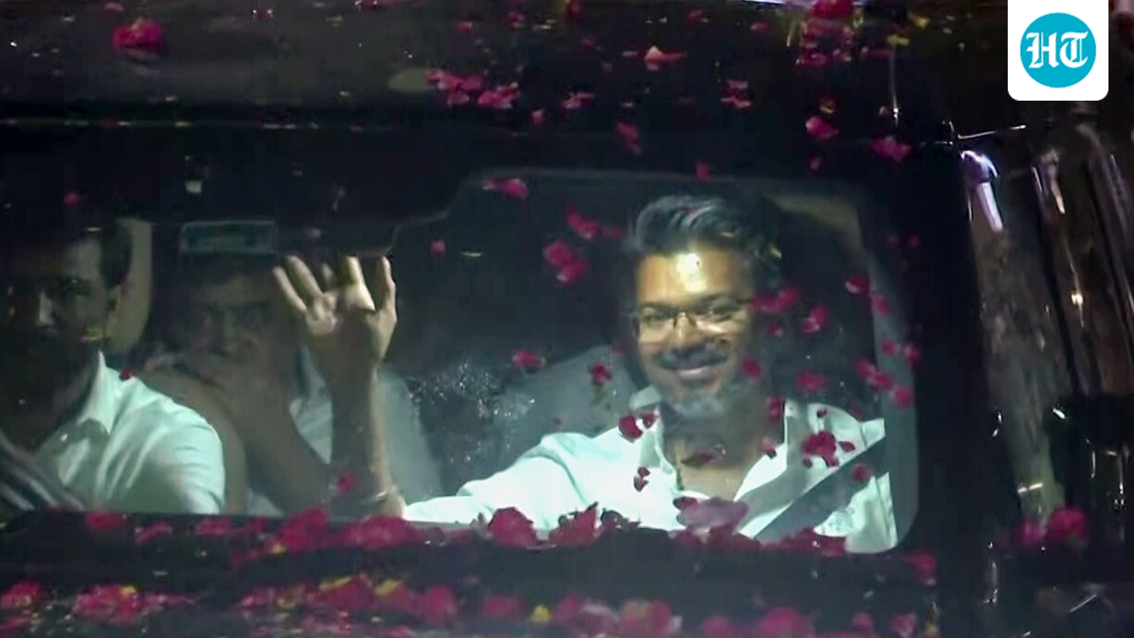 Watch: Vijay's supporters surround his car, shower petals as TVK makes historic Tamil Nadu debut