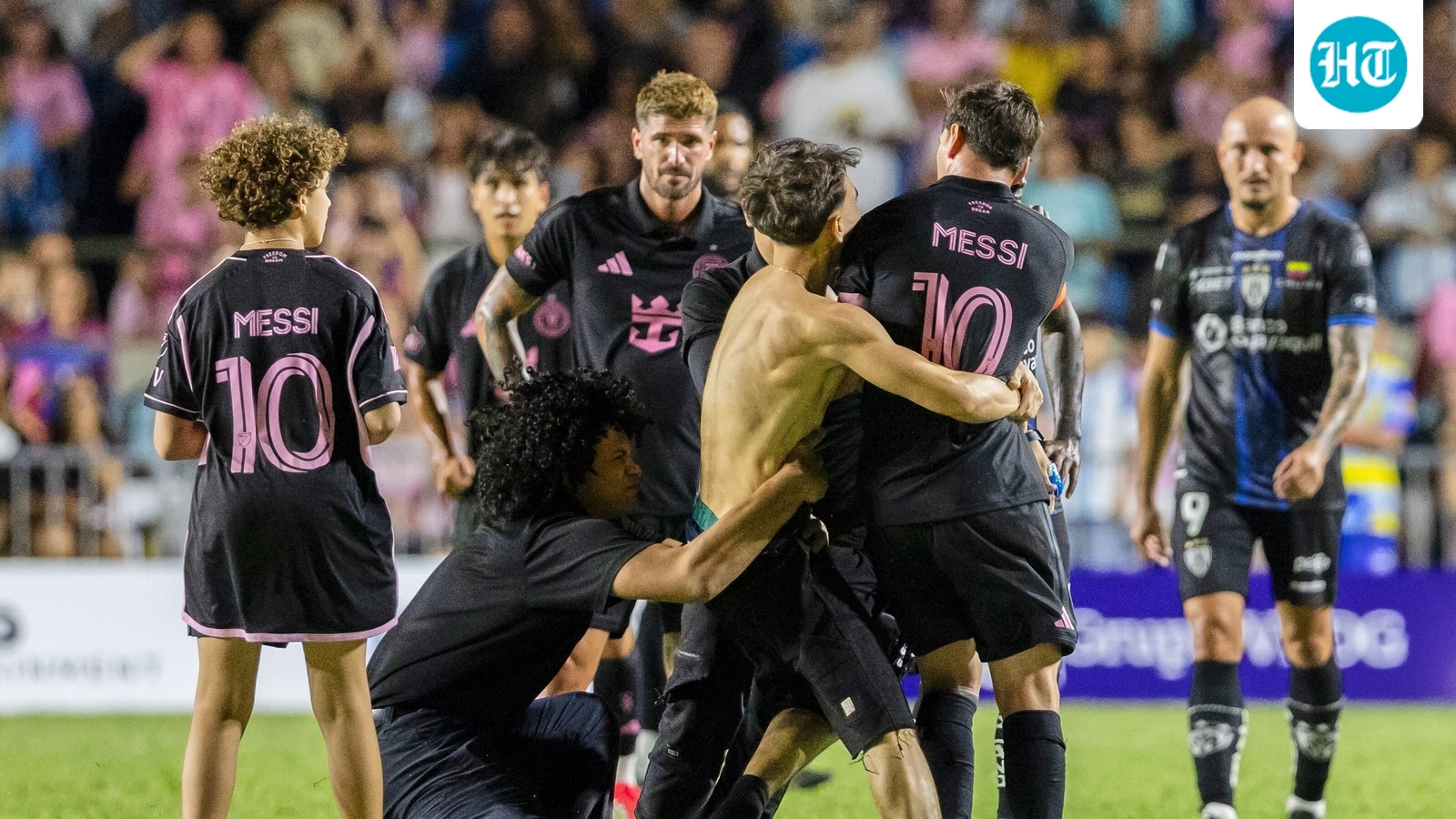 Lionel Messi knocked to the ground after fans cause ruckus during pitch invasion in Puerto Rico - Watch