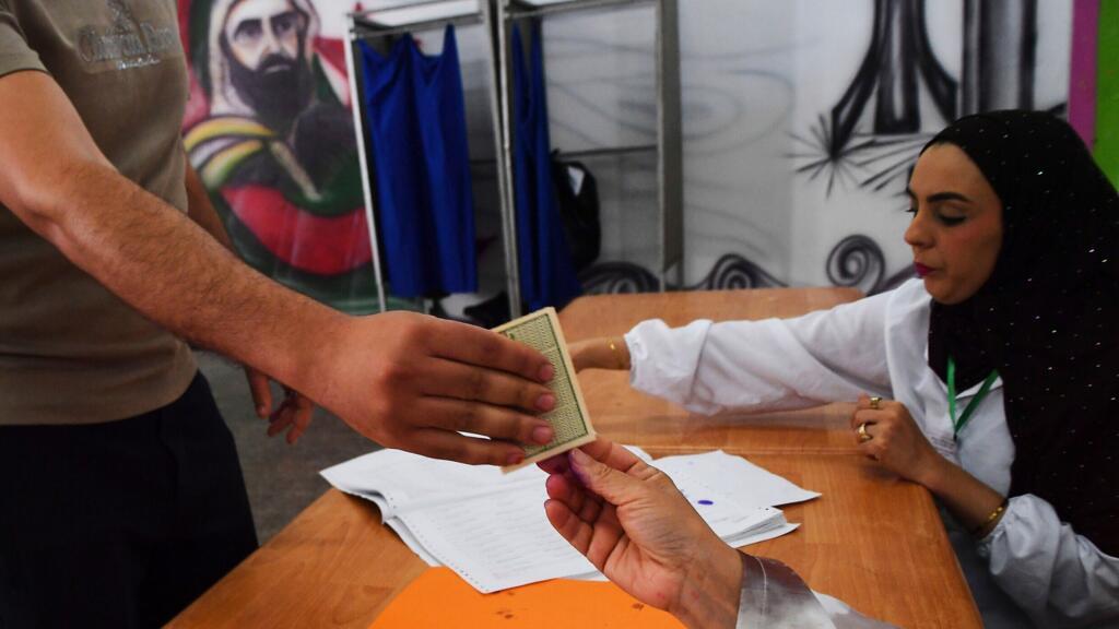 Algerians vote in parliamentary elections overshadowed by candidate bans