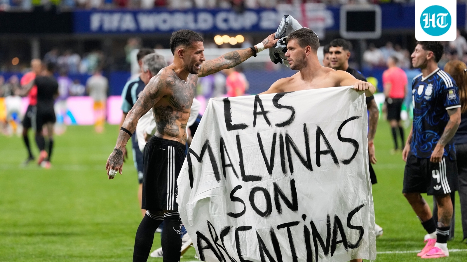 Argentina players display Falklands banner after World Cup win over England; in danger of facing FIFA sanctions
