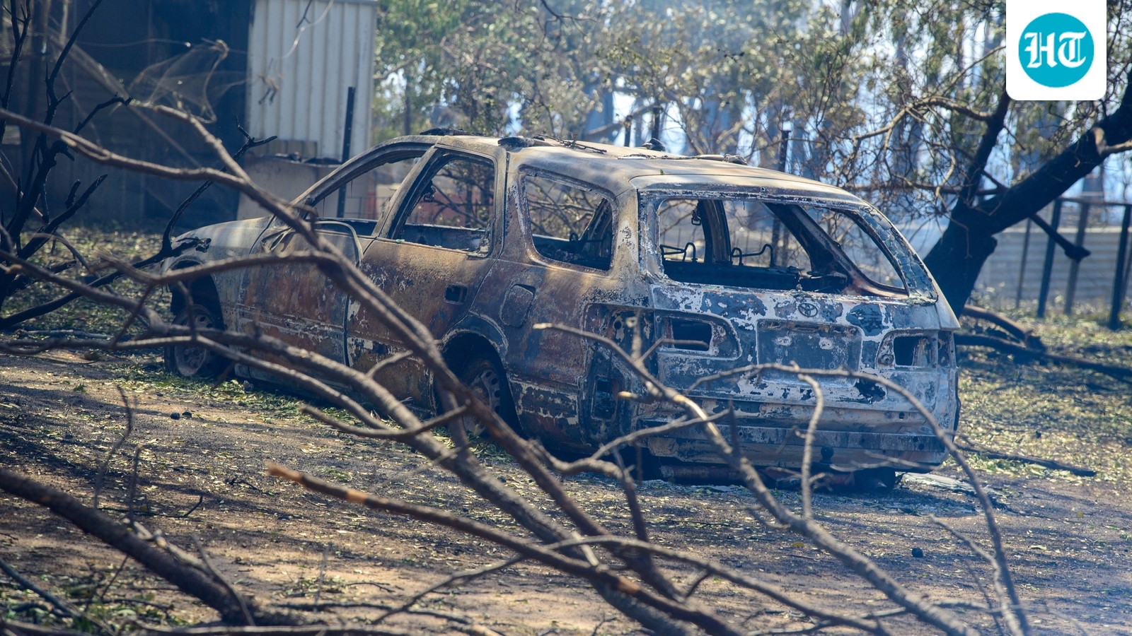 Australian bushfires raze homes, cut power amid intense heatwave