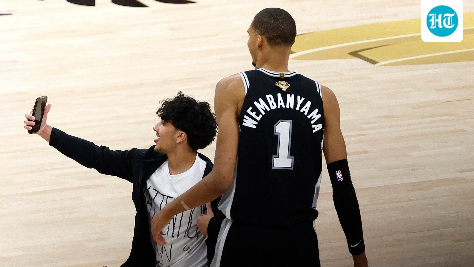 WATCH: Fan runs onto NBA Finals court to film Victor Wembanyama, security rushes in