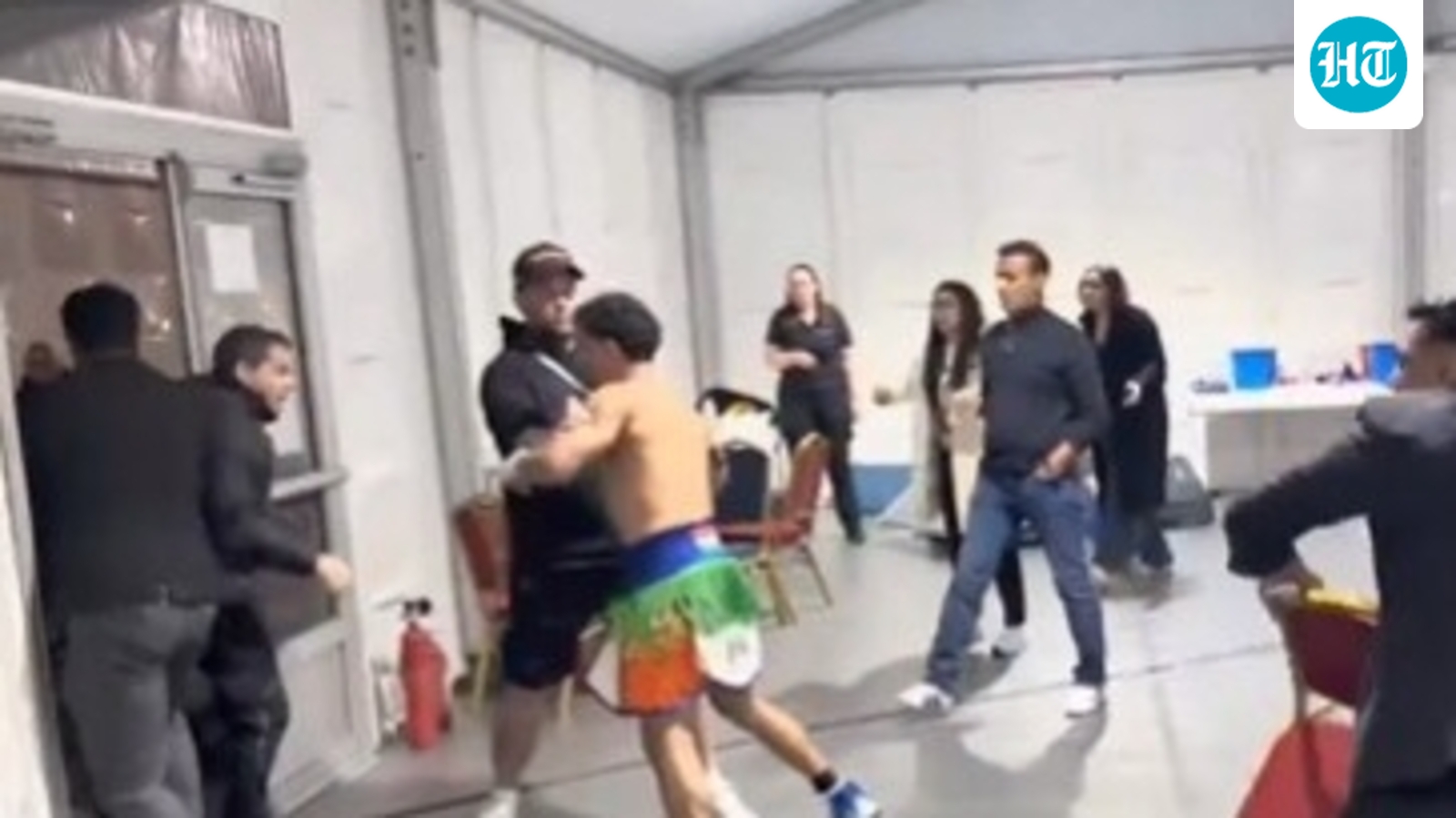 Manager Vipin Gulia shields Neeraj Goyat during post-fight altercation in Dubai