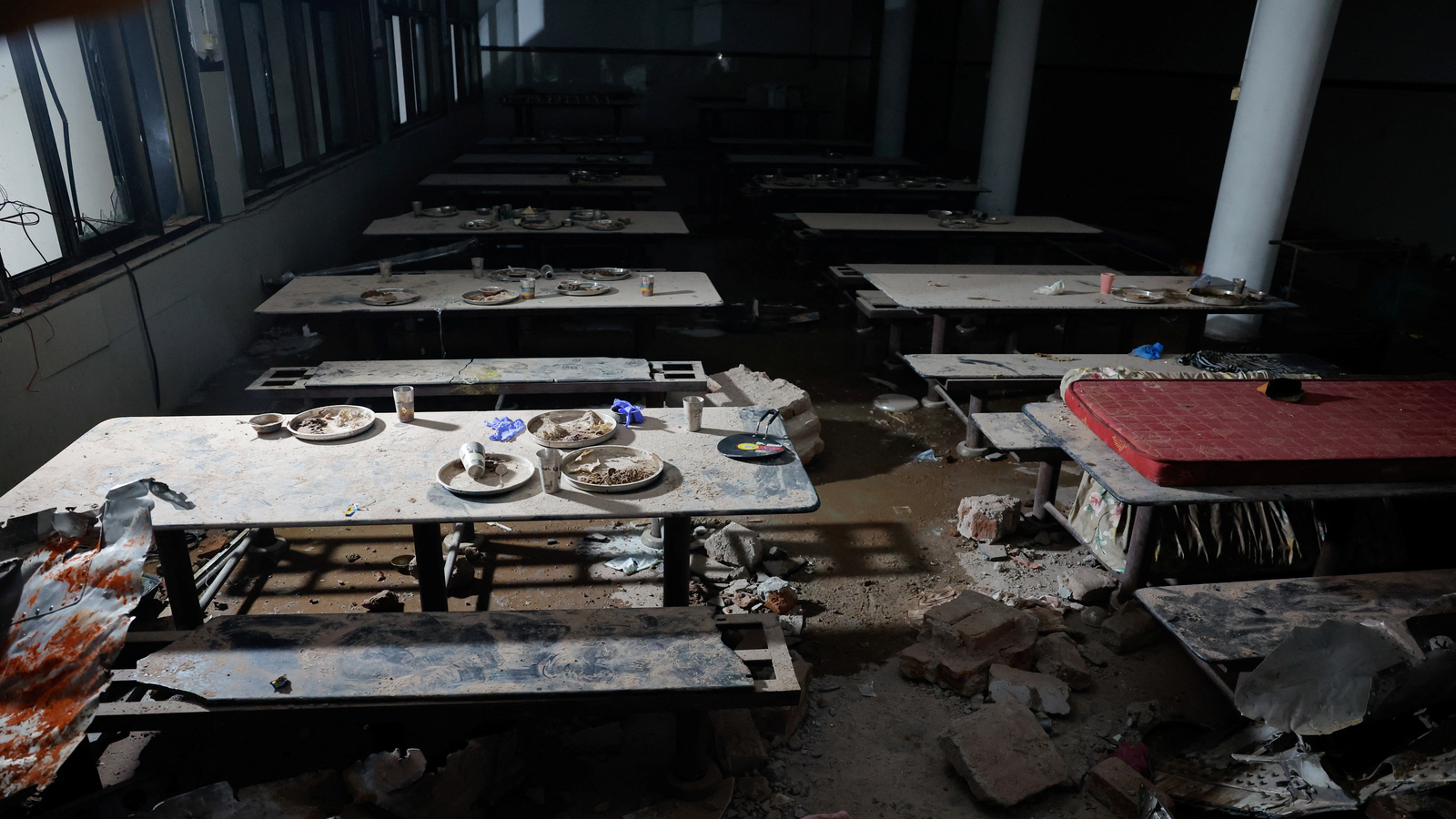Lunch plates abandoned, plane parts in walls after Air India jet hit doctors' hostel