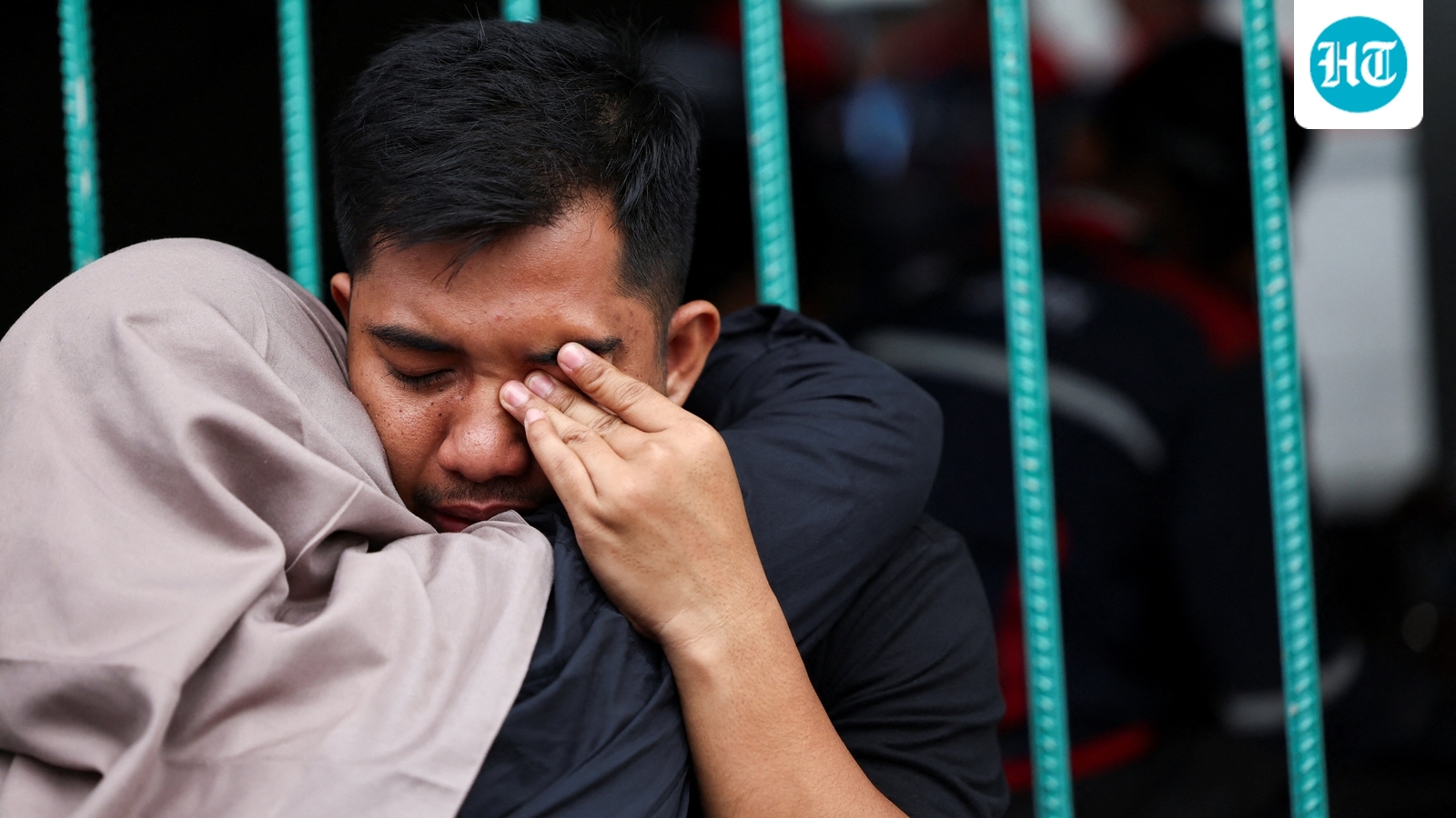 Indonesia train collision death toll rises to 14 as rescuers work to remove trapped passengers