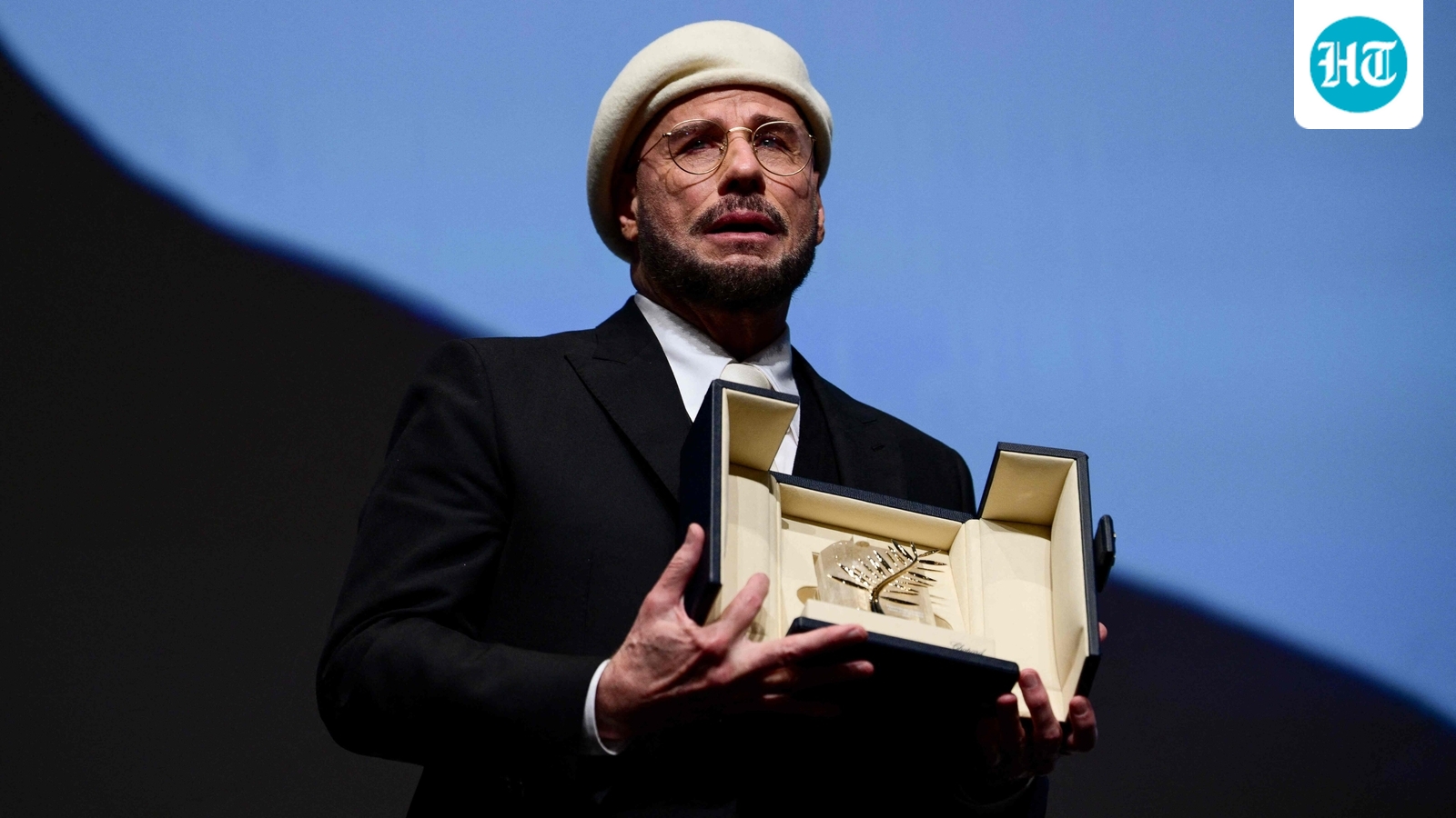 John Travolta breaks down in tears after getting surprise honorary Palme d'Or at Cannes Film Festival: ‘Beyond Oscar…’