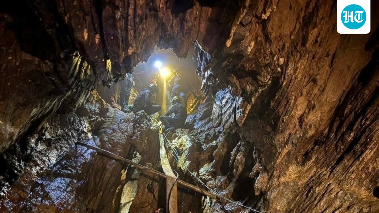 Rescuers free 4 men who had been trapped in a flooded Laos cave, search for 2 missing underway