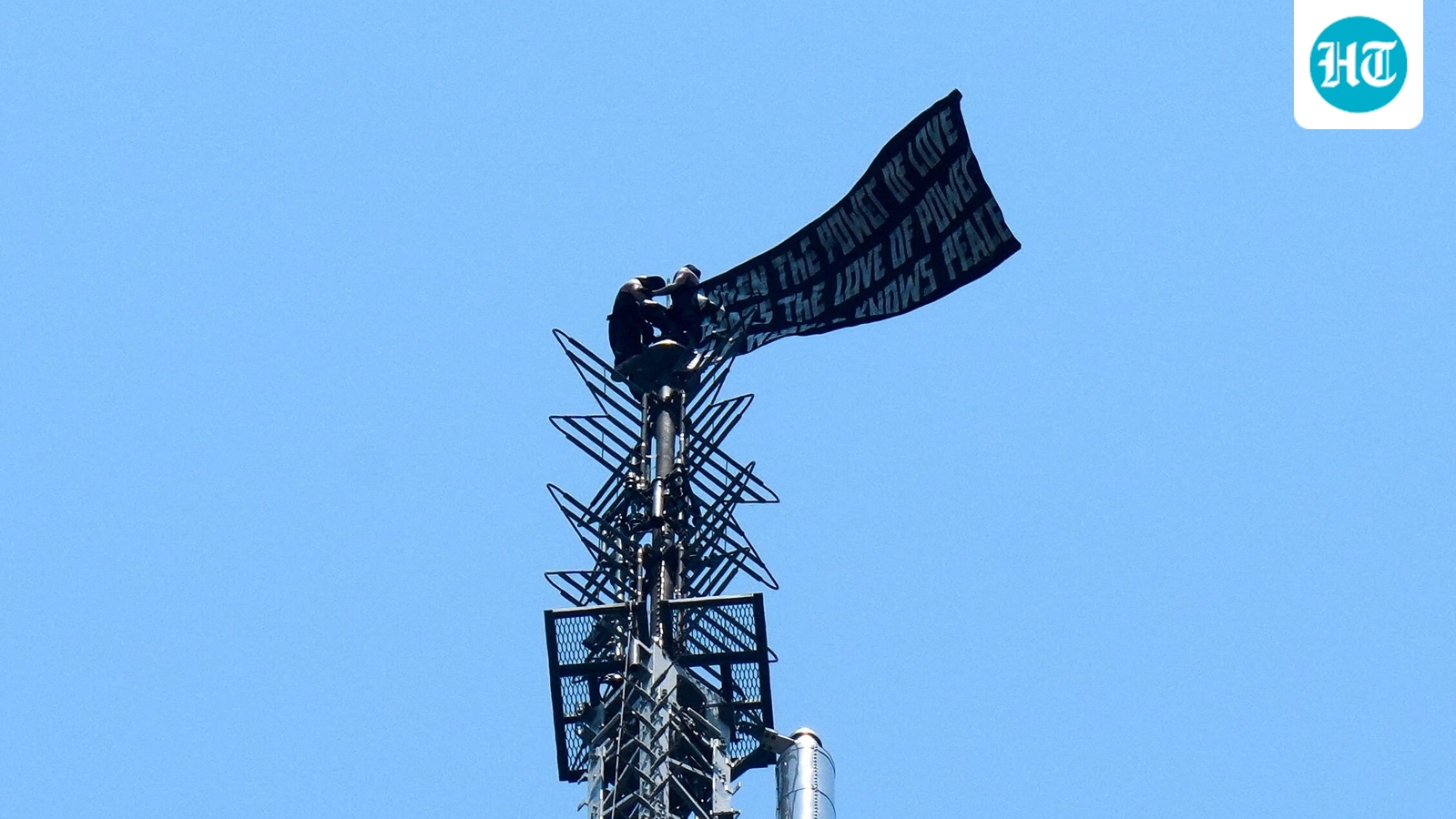 Two people climb to top of NYC's Empire State Building, unfurl massive banner, ‘When the power of love beats…’