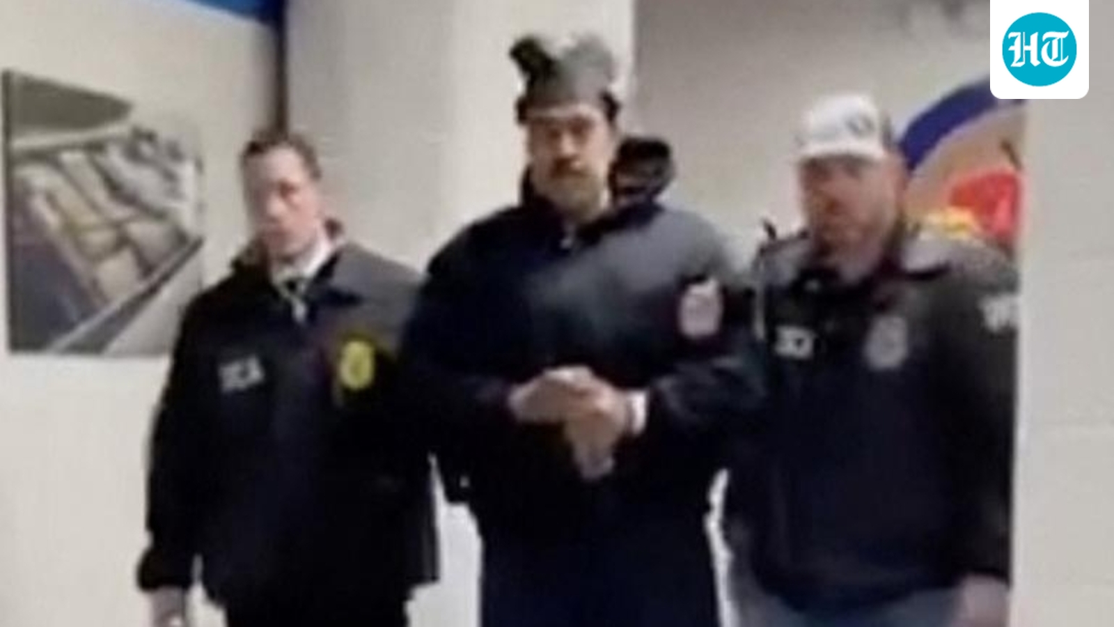 Nicolas Maduro brazenly flashes peace sign as he arrives at notorious jail after dramatic capture | Watch