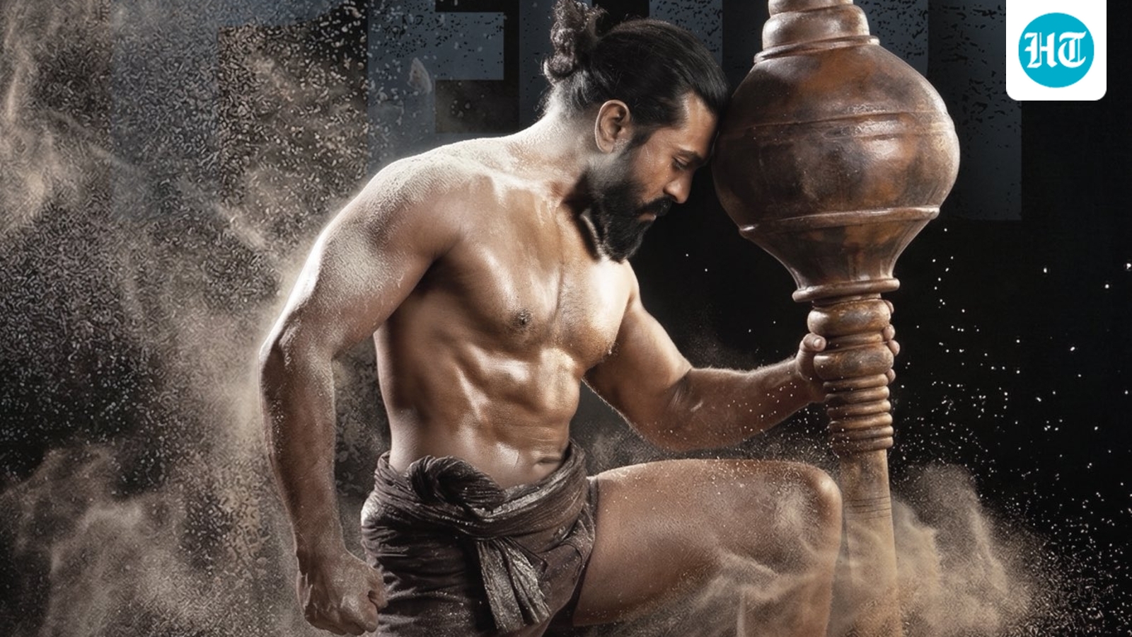 Peddi birthday glimpse shows Ram Charan as pehelwan; fans confused about switch from cricket, predict dual roles. Watch