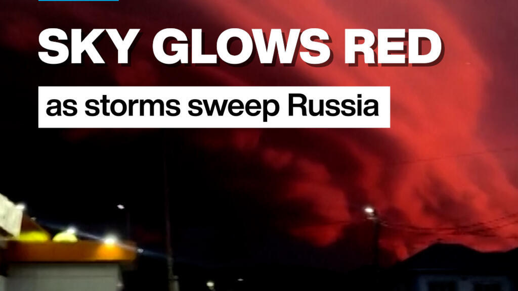 Sky glows red as storms sweep Russia