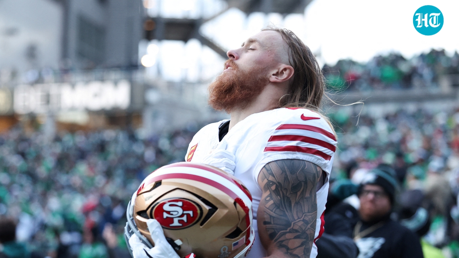 Why is George Kittle not playing tonight vs Seahawks? Injury update as 49ers TE, wife Claire cheer from the couch