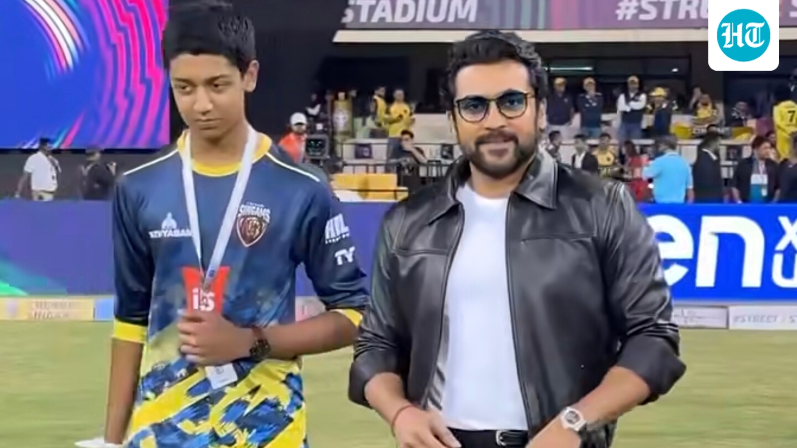 Suriya's son Dev attends ISPL match with father; fans call him ‘junior Singam’ as they meet Ajay Devgn. Watch
