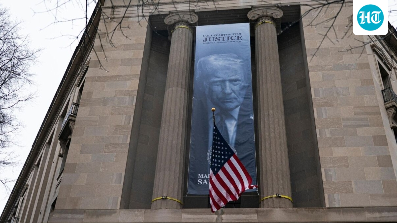 Trump's face on giant banner at justice dept HQ; ex-FBI chief says ‘sickening to see’