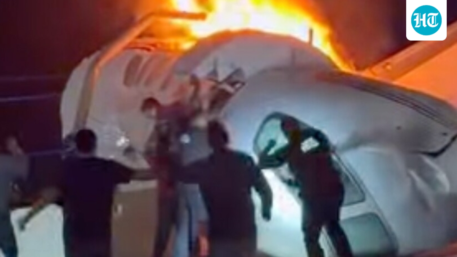 Laredo, Texas plane crash: Shocking video shows first responders breaking cockpit window as fire engulfs aircraft
