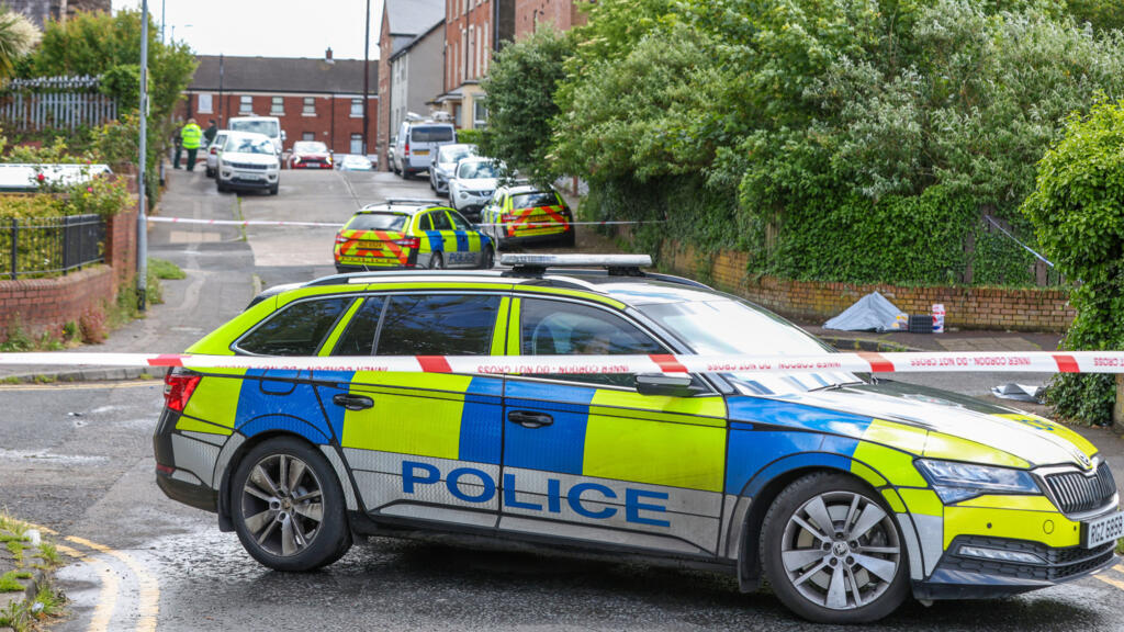 Appeals for calm after 'sickening' Belfast stabbing spurs protest calls