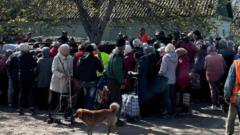 To stay or risk the 'Road of Death' - Ukrainian civilians trapped in frontline city