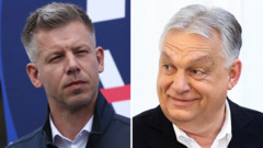 Hungarians vote in record numbers on whether to end Orbán rule and elect rival