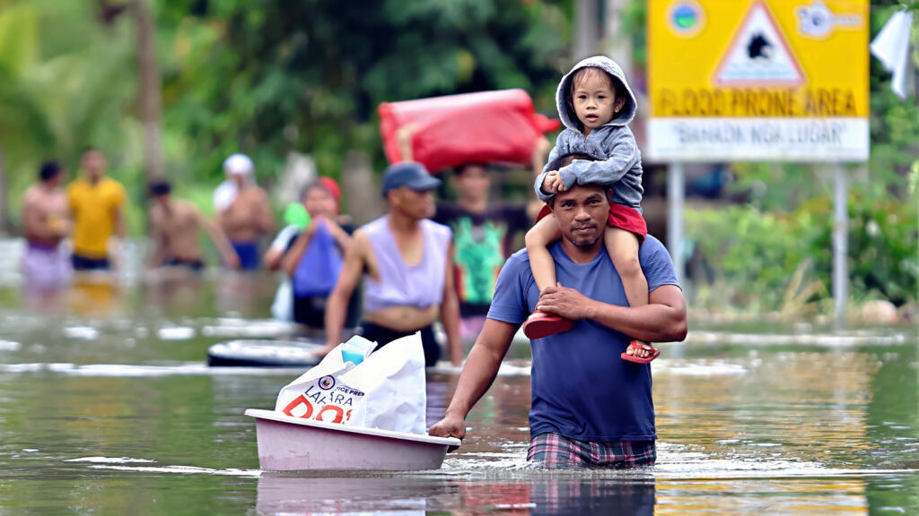 Philippines evacuates nearly a million as floodwaters rise and super typhoon nears