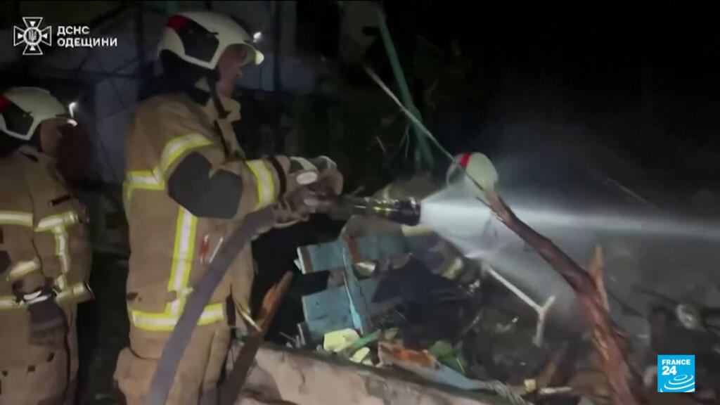 Russian attack on Ukraine kills at least 14 and traps others in damaged buildings