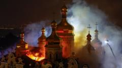 Russian strikes kill nine and set historic cathedral in Kyiv ablaze