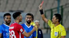 With no team in World Cup, China fans rally around a red card-happy referee