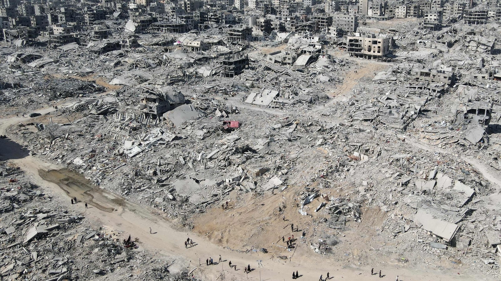 Palestinians find Gaza city in ruins as Hamas warns tough talks ahead