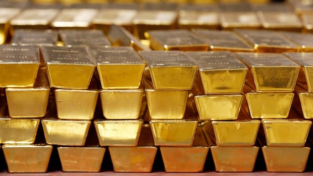 Gold prices hit record high as anxious investors seek safe haven for money