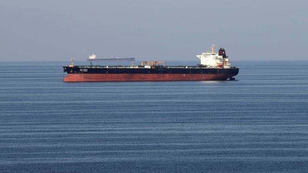 What is the Strait of Hormuz and what could happen to oil prices if Iran shuts it down?