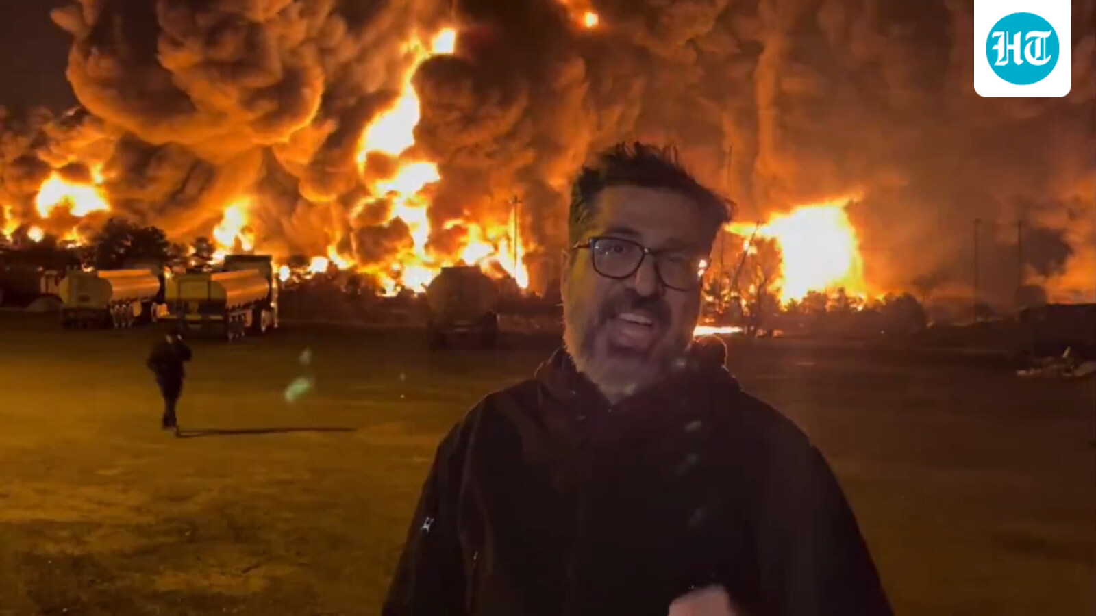 Iranian journalist reports near burning oil depot, viral video shows towering smoke