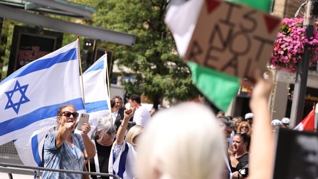TIFF screening of Oct. 7 documentary brings protesters and a standing ovation for its director